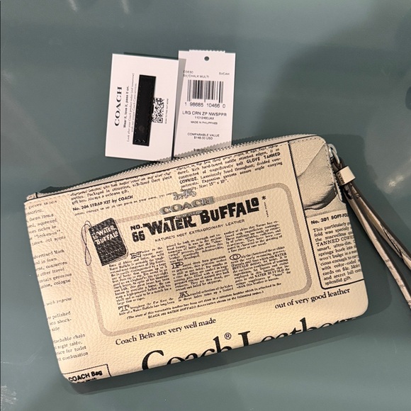 Coach Handbags - ⭐️Collecteable⭐️ Coach Cream and Black Printed Leather Wristlet